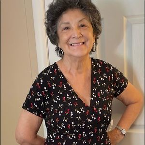 Lark & RO mini dress great fit has roses on base black background